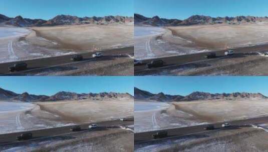 航拍冬季新疆赛里木湖雪山环湖公路夕阳车辆高清在线视频素材下载