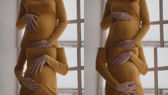 女人在家里抚摸怀孕的肚子爱未来的母亲关心高清在线视频素材下载