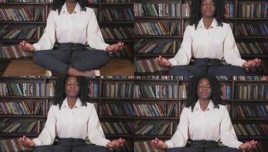 穿着白色衬衫的黑人妇女坐在瑜伽中，在桌子高清在线视频素材下载