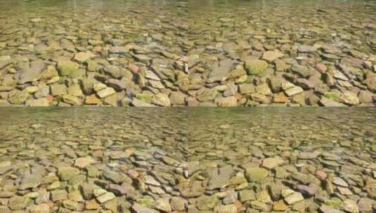 实拍小溪河底的清澈石子高清在线视频素材下载