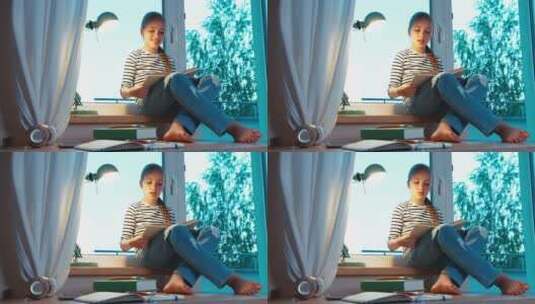 学生坐在她房间的窗台上看书高清在线视频素材下载