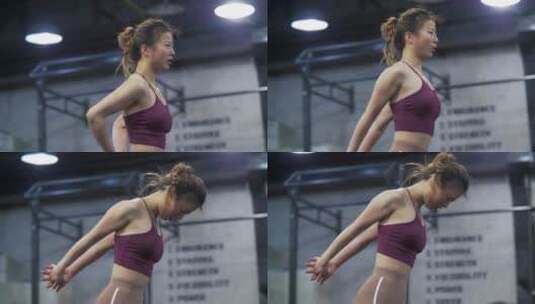 健身房里锻炼身体健身的女青年高清在线视频素材下载