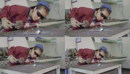 女电焊技工现场操作高清在线视频素材下载