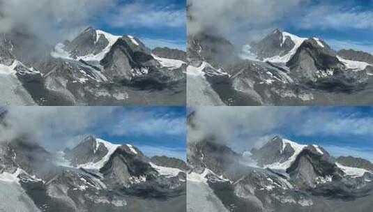 云雾缭绕的四川甘孜党龄山脉主峰夏羌拉雪山高清在线视频素材下载