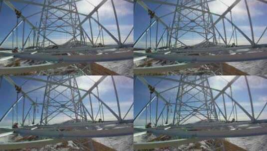 4K西藏5200米雪山电力铁塔组立横担吊装04高清在线视频素材下载
