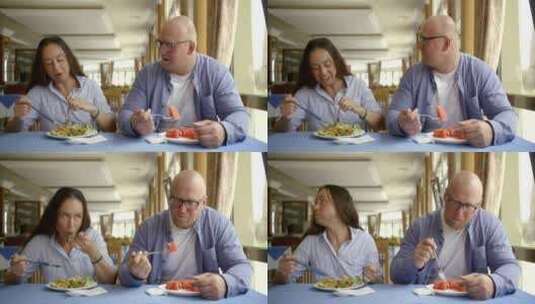 男人和女人边吃饭边聊天高清在线视频素材下载