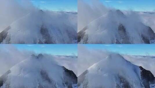 航拍四川甘孜云雾缭绕的乌库楚雪山风光高清在线视频素材下载
