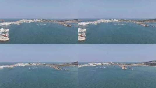 航拍晴天阳光威海西港小石岛港湾快艇渔船高清在线视频素材下载
