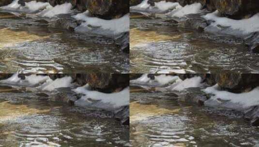 江南中式古典园林雪后屋檐水滴产生涟漪水花高清在线视频素材下载