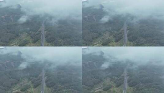 云雾下的高速公路俯拍森林公路云雾缭绕山区高清在线视频素材下载