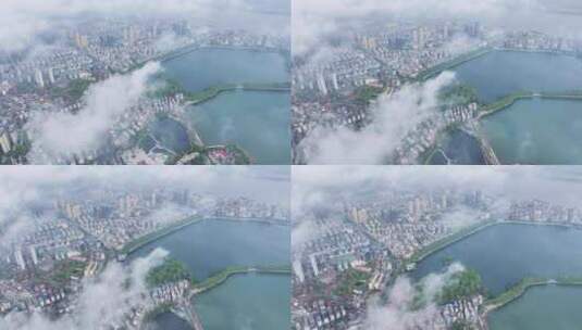 九江市春季低空云雾下的甘棠湖与南湖及长江高清在线视频素材下载