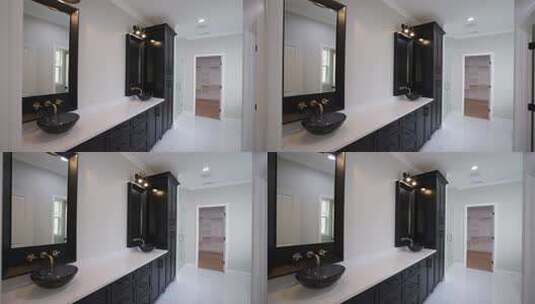 带黑色橱柜和双水槽的浴室高清在线视频素材下载