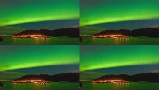 夜空下极光映照城市与山脉高清在线视频素材下载