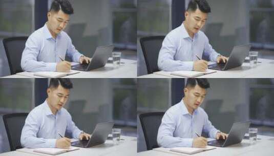 男性商务人士办公室使用笔记本电脑办公高清在线视频素材下载