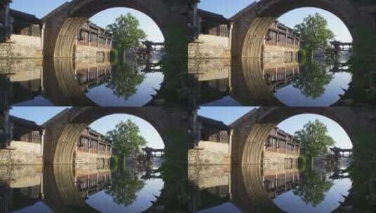 航拍湖州南浔江南古镇河流拱桥倒影老房子高清在线视频素材下载