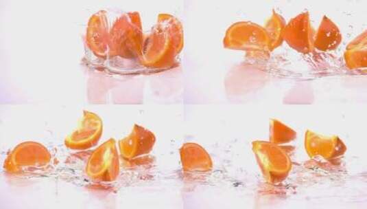 掉进水里的橙色切片高清在线视频素材下载