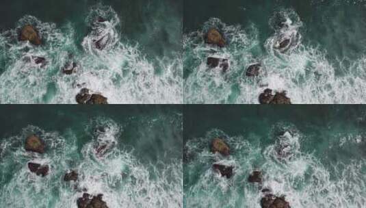 航拍海浪冲向岸边石头高清在线视频素材下载