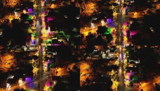 航拍在夜晚的街道上的彩色灯光高清在线视频素材下载