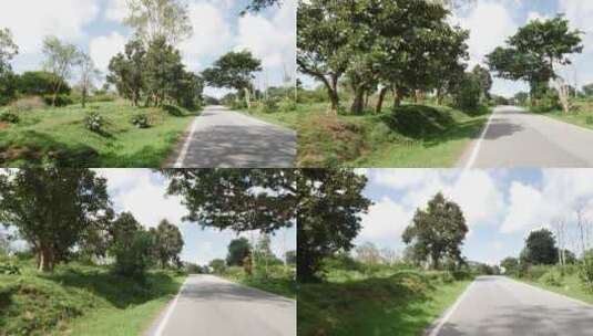 印度的乡村道路，道路两旁的树木和草地高清在线视频素材下载