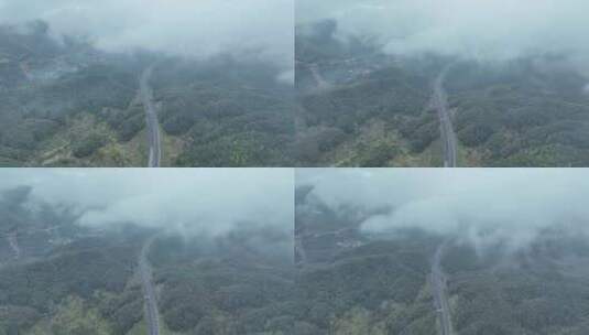 云雾下的高速公路俯拍森林公路云雾缭绕山区高清在线视频素材下载