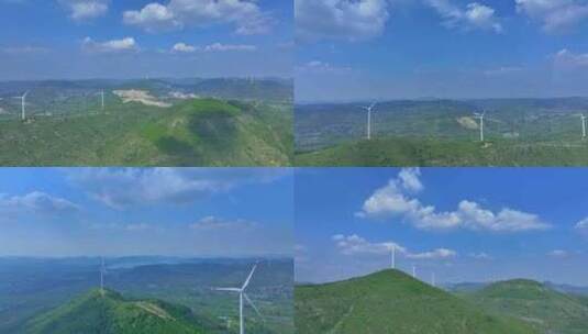 航拍蓝天白云朵朵飘的山上风力发电高清在线视频素材下载