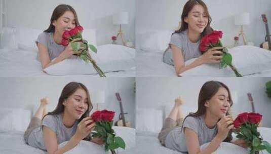 亚洲年轻美女在家卧室看玫瑰花。高清在线视频素材下载