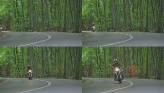 骑着摩托车穿过森林高清在线视频素材下载
