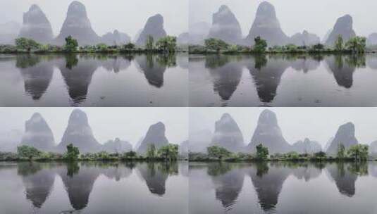 雨天湖景倒映绿树青山的宁静画面高清在线视频素材下载