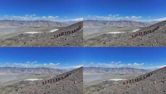 航拍攀登新疆慕士塔格峰雪山的登山队高清在线视频素材下载