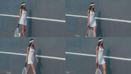 拿网球拍靠墙走的女孩高清在线视频素材下载