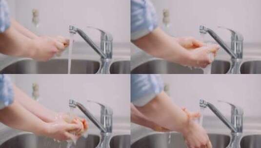 医生正在用水龙头里的水洗手高清在线视频素材下载