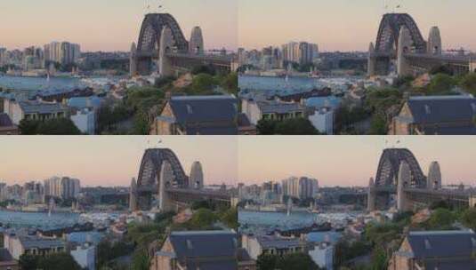 日落时分岩石上的大桥和港口高清在线视频素材下载