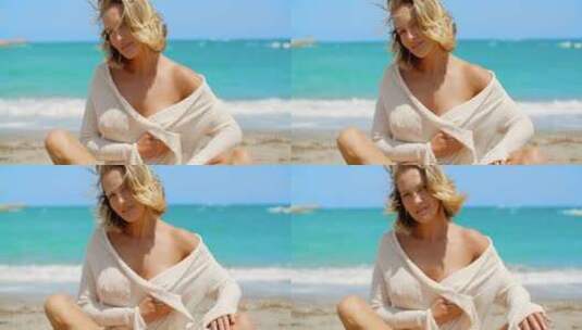 性感美女坐在沙滩上高清在线视频素材下载