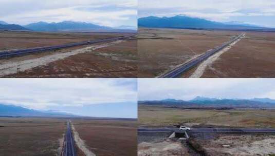航拍车子行驶在新疆，一望无际的荒原雪山下高清在线视频素材下载