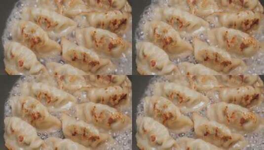 在平底锅里煎饺子，中国著名的食物高清在线视频素材下载
