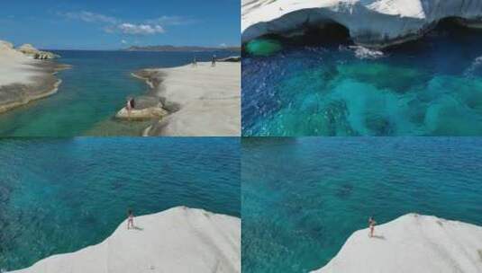 比基尼美女在海岛礁石晒日光浴希腊米洛斯岛高清在线视频素材下载