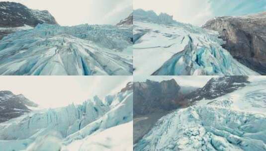 FPV穿越机无人机航拍冰山冰川山脉天空瑞士高清在线视频素材下载