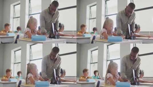 快乐的非裔美国男老师帮助高加索女孩锻炼的视频高清在线视频素材下载