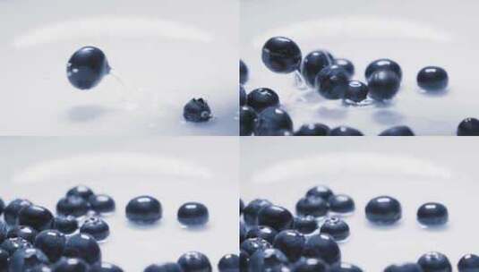 蓝莓果落在水上的慢动作高清在线视频素材下载