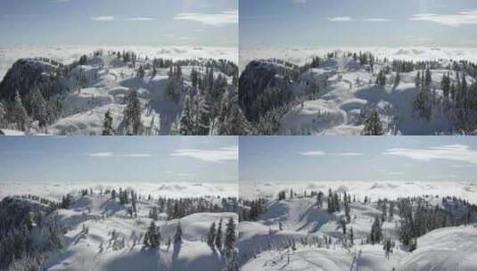 航拍雪山上滑雪的人高清在线视频素材下载