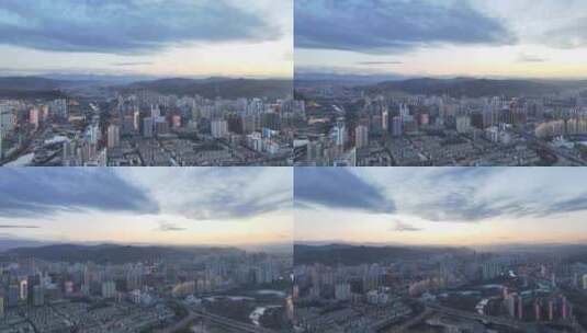 航拍冬季黄昏时分的青海西宁城市风光高清在线视频素材下载