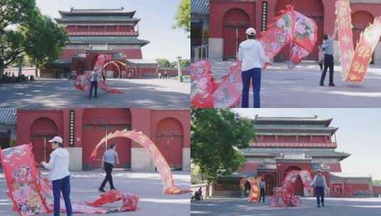 北京早晨舞彩带龙的老年人市民高清在线视频素材下载
