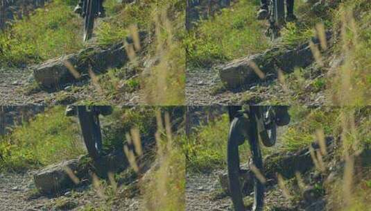 一名山地自行车手慢动作跳过一块锋利的岩石高清在线视频素材下载