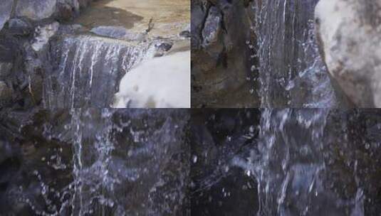 传统中式园林公园内太湖石假山流水瀑布高清在线视频素材下载