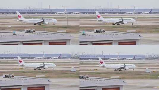 日本航空飞机在浦东机场跑道滑行高清在线视频素材下载