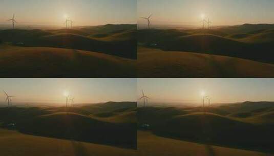 航拍山坡上的风力发电机高清在线视频素材下载