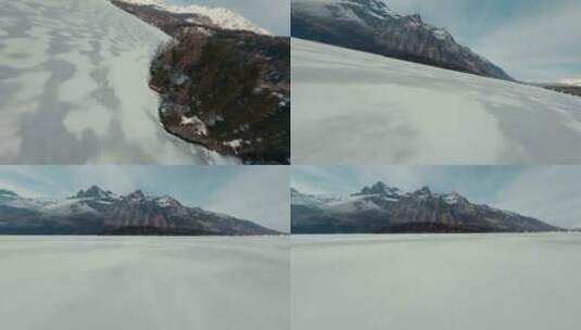 FPV穿越机无人机航拍冬天雪地河流雪山空镜高清在线视频素材下载