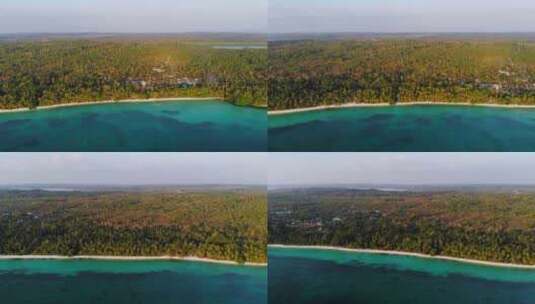 空中：印度尼西亚马鲁古群岛未受污染的白色沙滩日落高清在线视频素材下载