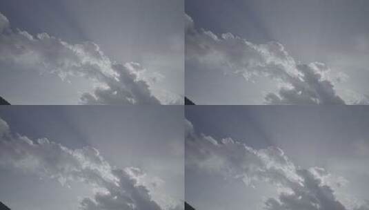天空中快速移动的云和太阳光丁达尔耶稣光高清在线视频素材下载