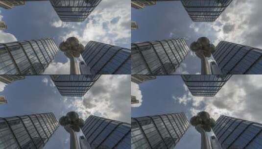 仰拍视角高层现代建筑与天空云朵流动高清在线视频素材下载